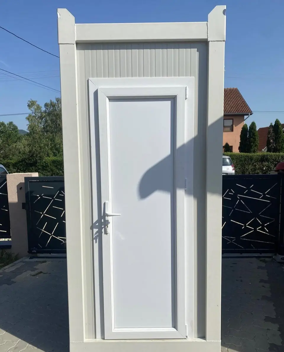 White VIP cabin restroom with a full-size door